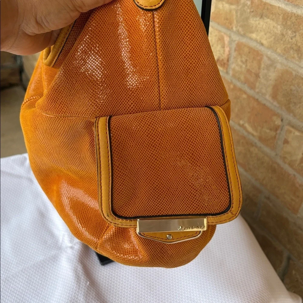 B. Makowsky Orange Hobo Bag